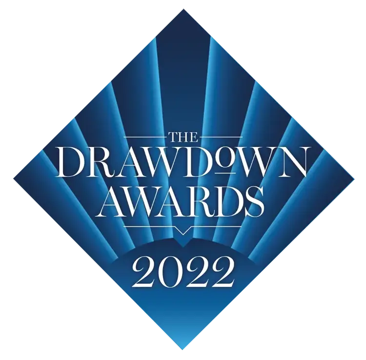 Logo for The Drawdown Awards 2022, featuring white text on a blue diamond-shaped background with radiating light blue beams.